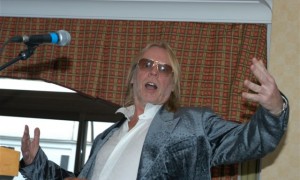 Rick wakeman at golf dinner with microphone