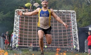 Man jumps through flames to support Sparks at the Spartan stadium race