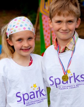 Do a challenge for Sparks Two children wearing Sparks t-shirts and medals