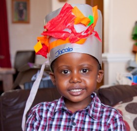 Jacob models the hat he made at school
