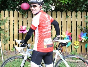 Matt is doing Land's End to John O'Groats Matt in his cycle jersey with bike before doing Land's End to John O'Groats