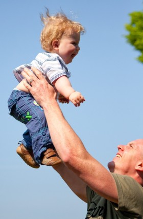 Riley and Dave Dave throwing his son Riley in the air
