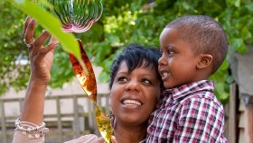 Sheree and Jacob Sheree and her son Jacob play with the colourful ornament on the tree